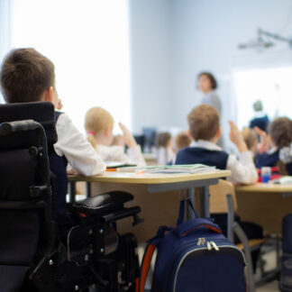 A student who is a wheelchair user in primary school.