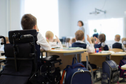 A student who is a wheelchair user in primary school.