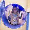 Child crawling through tunnel
