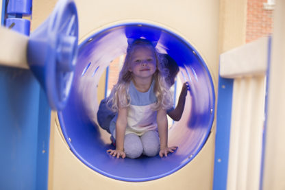 Child crawling through tunnel