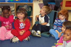 An accommodation is made to a chair so a child can participate in circle time.