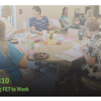 Course catalog image for Putting FET to Work features a training room with multiple people speaking to each other.