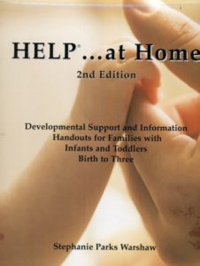 The Help at home cover features a picture of an infants fingers held in an adults hand