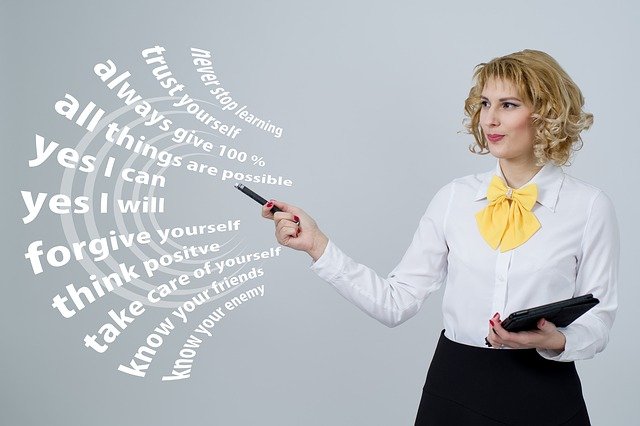 woman standing pointing to positive thought statements