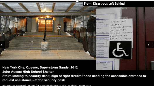 A photo of a staircase leading into an emergency shelter. A handwritten sign directs those needing the accessible entrance to request assistance - at the top of the stairs