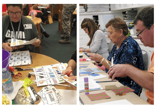 People at tables cutting out items and using other craft supplies.