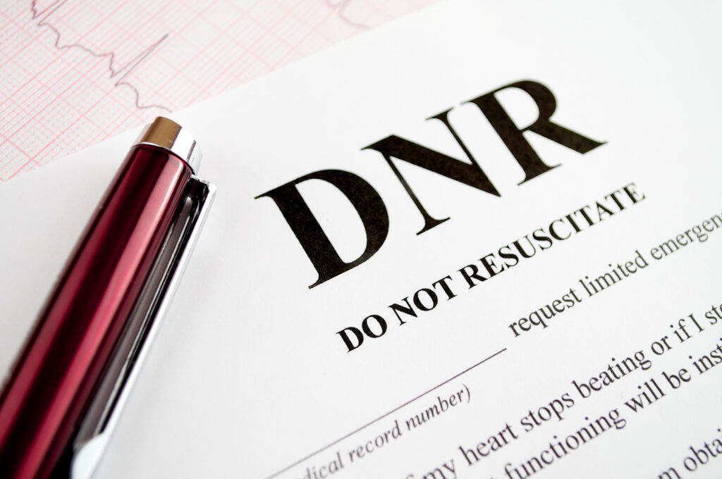 Do not Resuscitate form on a table with a pen on the paper.