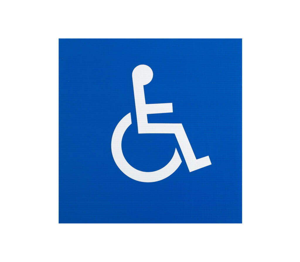 White disabled sign against a blue background