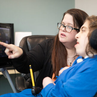 Annabelle works with an aide in her class.