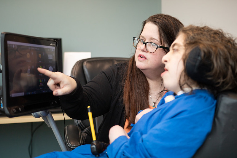 Annabelle works with an aide in her class.